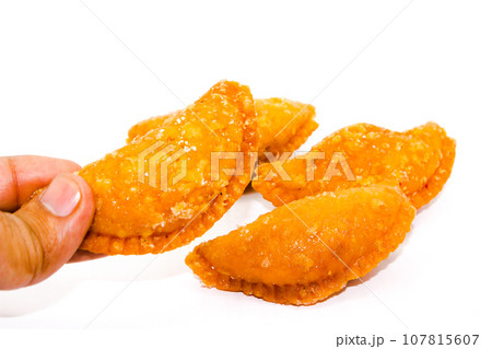Gujiya on white background with selective focus 107815607