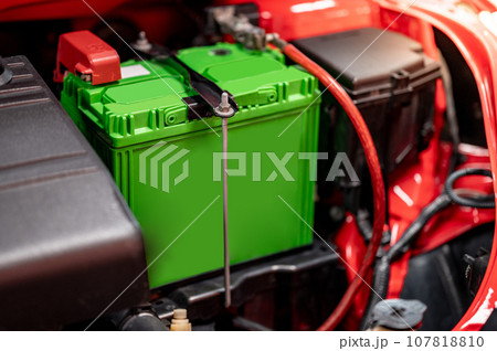 New green car battery installed near the car engine New green car battery installed near the car engine 107818810