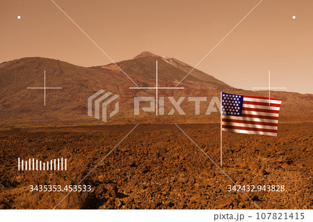 Red desert landscape with US flag hrough viewfinder 107821415