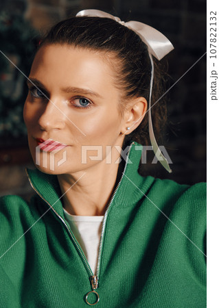 Portrait of beautiful woman during winter holidays 107822132