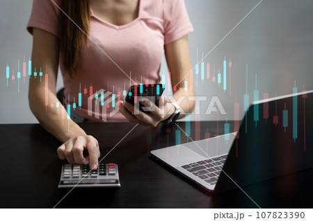 Close up of businessman working on calculator to calculate financial data report, accountancy document and laptop computer at office, business concept. Close up of businessman working on calculator to calculate financial data report, accountancy document and laptop computer at office, business concept. 107823390