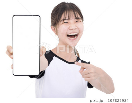 Happy Asian girl holding smartphone mockup of blank screen 107823984