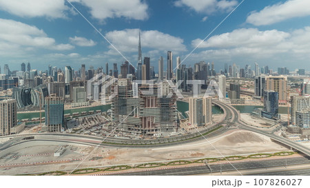Panorama showing skyline of Dubai with business bay and downtown district timelapse. Panorama showing skyline of Dubai with business bay and downtown district timelapse. 107826027