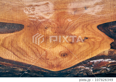 Clean modern wooden background with resin. The texture of old light wood with stain and transparent epoxy resin in cracks. High quality photo 107826349