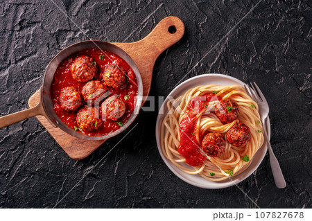 Meatballs. Beef meat balls, overhead flat lay shot in a pan and with spaghetti Meatballs. Beef meat balls, overhead flat lay shot in a pan and with spaghetti 107827678