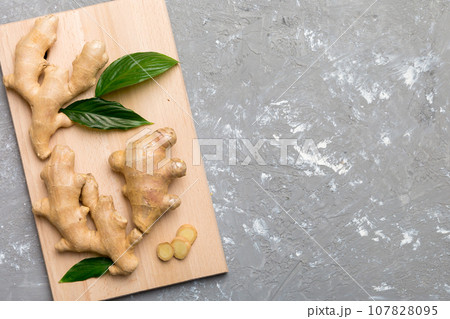 ginger on Cutting board table, top view. Space for text ginger on Cutting board table, top view. Space for text 107828095