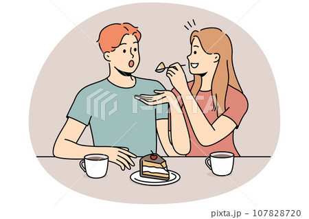 Happy couple eating cake together 107828720