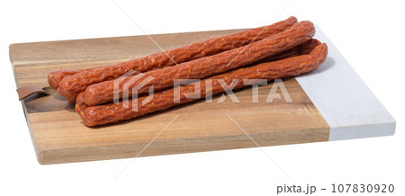 Traditional Polish thin smoked sausages on a white isolated background 107830920