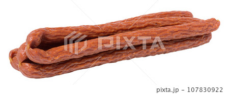 Traditional Polish thin smoked sausages on a white isolated background Traditional Polish thin smoked sausages on a white isolated background 107830922