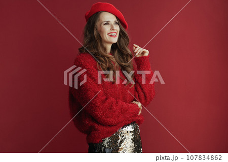 happy stylish woman in red sweater and beret 107834862