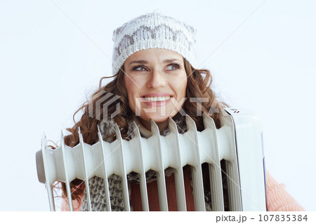 happy trendy woman in sweater, mittens, hat and scarf on white happy trendy woman in sweater, mittens, hat and scarf on white 107835384