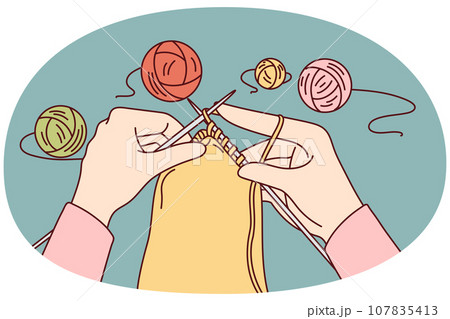 Woman knitting with needles 107835413