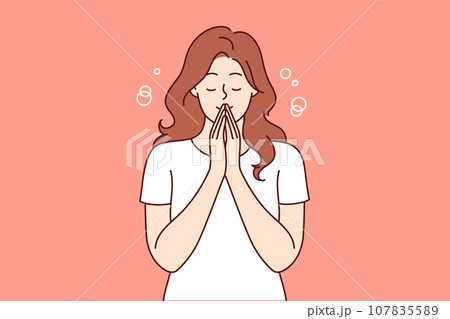 Praying woman performs meditation or religious ritual to purify thoughts and get rid of bad emotions Praying woman performs meditation or religious ritual to purify thoughts and get rid of bad emotions 107835589