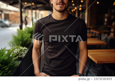 A Young Man Dons a Bella Canvas Black T-Shirt and Jeans, Enjoying a Relaxing Day at a Cozy Restaurant, Featuring a T-Shirt Design Template and Print Presentation Mockup. created with Generative AI 107836405