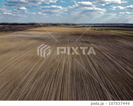 Treated farm field, aerial view. Agricultural land. Treated farm field, aerial view. Agricultural land. 107837449