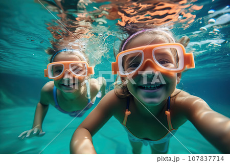 Two Young Children Wearing Swim Goggles Delight in Carefree Summer Fun, Creating Cherished Childhood Memories. created with Generative AI Two Young Children Wearing Swim Goggles Delight in Carefree Summer Fun, Creating Cherished Childhood Memories. created with Generative AI 107837714