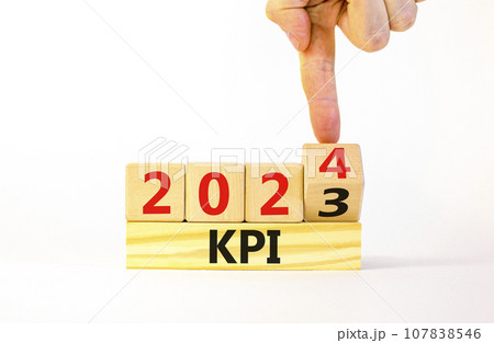 KPI, key performance indicator symbol. Businessman turns wooden cubes with words KPI 2023 and KPI 2024 on beautiful white background, copy space. Business KPI key performance indicator concept. 107838546