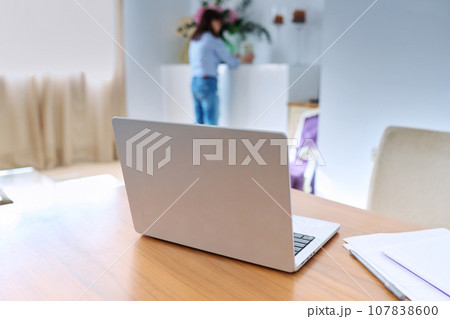 Close up laptop on table, home living room interior Close up laptop on table, home living room interior 107838600