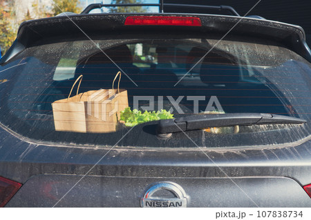 view of groceries bags in car trunk view of groceries bags in car trunk 107838734