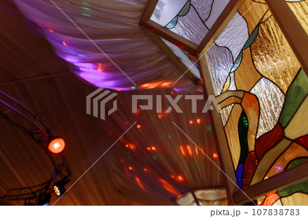 Colorful abstract stained glass window in tent Colorful abstract stained glass window in tent 107838783