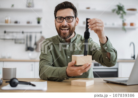 Male influencer recording video blog about new smart watch Male influencer recording video blog about new smart watch 107839386