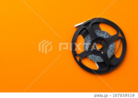 LED strip roll on bright orange background n LED strip roll on bright orange background n 107839519