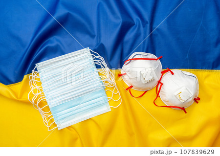 Medical face masks on flag of Ukraine Medical face masks on flag of Ukraine 107839629