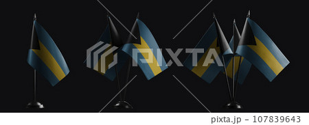 Small national flags of the Bahamas on a black background 107839643