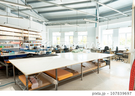 Interior of a sewing warehouse of furniture factory with equipment and materials 107839697