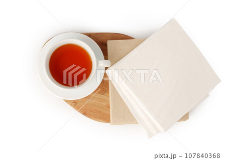 Cup of tea and paper napkin on white background 107840368