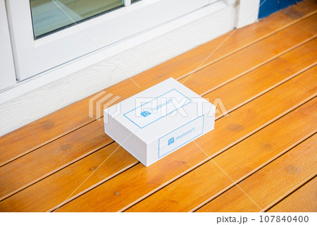 Buy online clinic retail Rx drug store, Medication package box Covid free first aid from pharmacy hospital delivery e-commerce on floor at door front home patient, online medical and healthcare 107840400