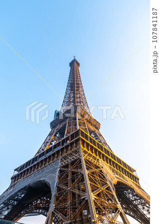 Eiffel Tower bottom-up view in the sunny morning. Paris, France Eiffel Tower bottom-up view in the sunny morning. Paris, France 107841187