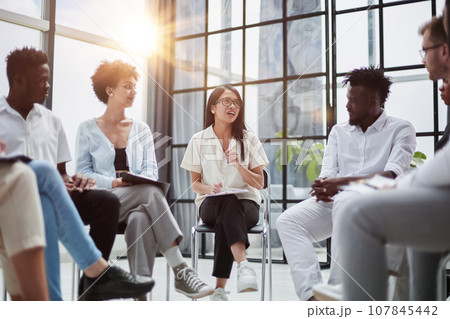 Business and entrepreneurship. sitting in a modern office and giving a lecture for career growth 107845442