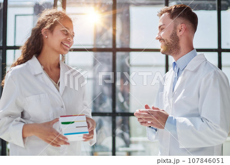 doctors holding pills in hand in hospital room doctors holding pills in hand in hospital room 107846051