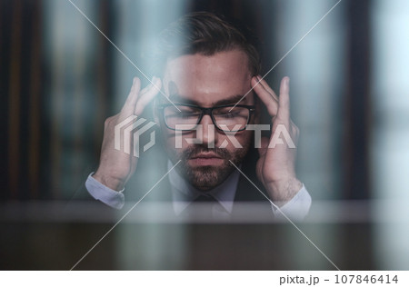 You shouldnt have to think twice about going online. a handsome young businessman sitting behind his laptop in his office. 107846414