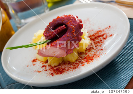 Appetizing boiled octopus with mashed potatoes Appetizing boiled octopus with mashed potatoes 107847599