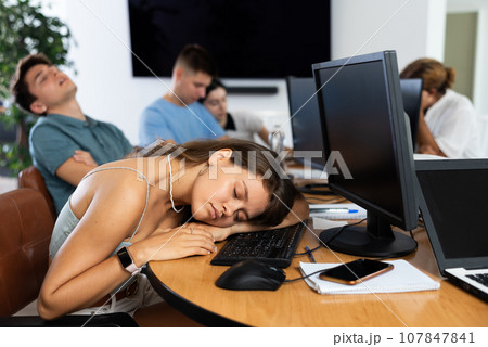 Exhausted students find solace in sleep Exhausted students find solace in sleep 107847841
