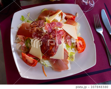 Ensalada catalana is a popular salad of Spanish cuisine 107848380
