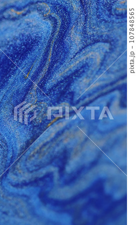 Blue paint wave shimmering sparkling ink Blue paint wave shimmering sparkling ink 107848565