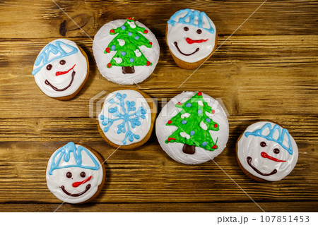 Christmas gingerbread cookies on a wooden background. Top view 107851453