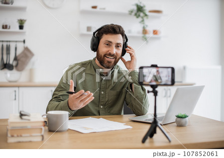 Popular blogger making educational video vlog at home 107852061