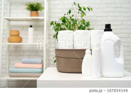 Liquid detergents containers on shelf in a bathroom 107854149