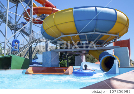 Playground with a swimming pool. water Park for children. colorful sports facilities autdoor games 107856993