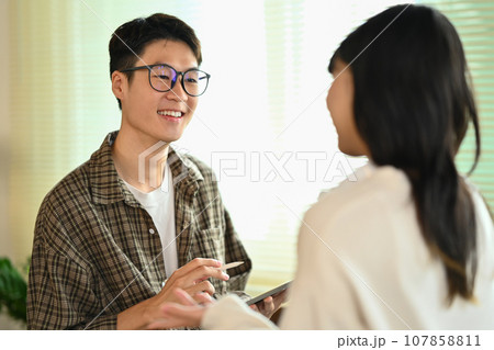 Two asian college students having break after classes and talking to each other. Youth lifestyle concept 107858811