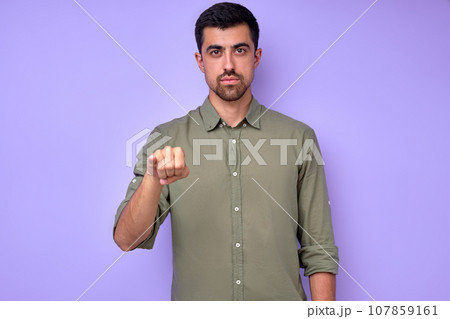 serious handsome man showing letter J j with fingers serious handsome man showing letter J j with fingers 107859161