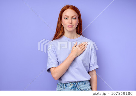 redhead girl putting her arm on her breast redhead girl putting her arm on her breast 107859186