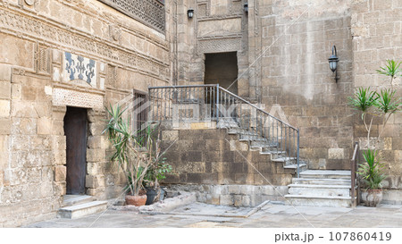 Courtyard of 14th century Prince Taz Palace in Cairo, Egypt, with staircase leading to the first floor Courtyard of 14th century Prince Taz Palace in Cairo, Egypt, with staircase leading to the first floor 107860419