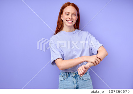 awesome happy girl touching her arm, keeping it awesome happy girl touching her arm, keeping it 107860679