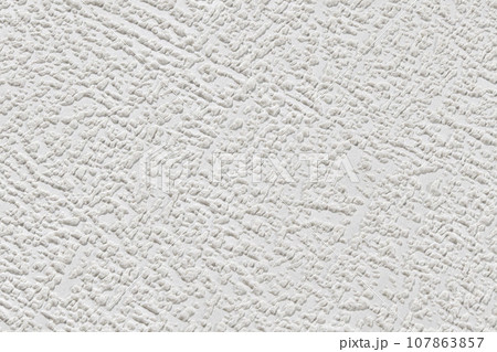 White texture of paper wallpaper with abstract stains. Plastered embossed wall. 107863857