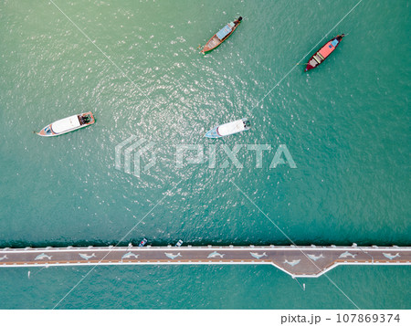 Aerial view of dolphin bridge with boats anchored at Chalong Pier 107869374